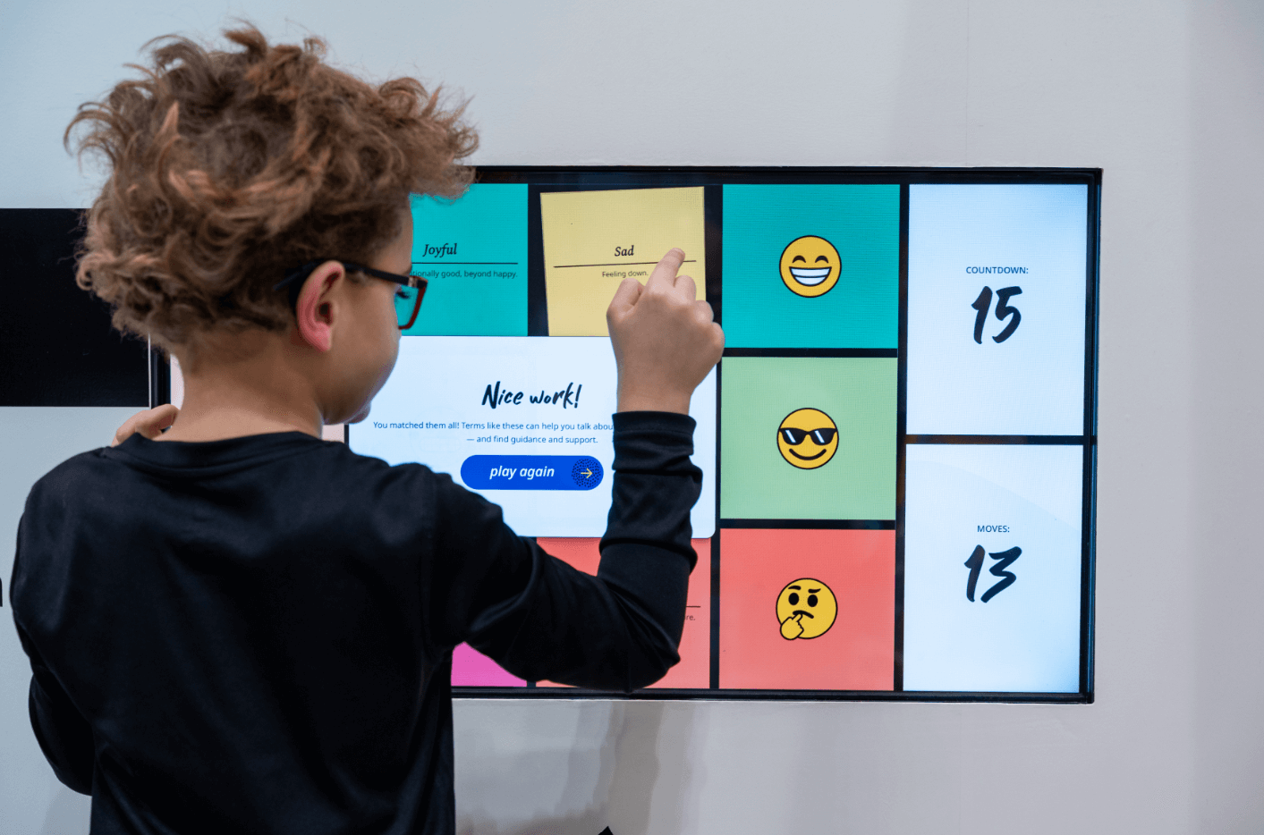 Child playing NBA emotion matching game